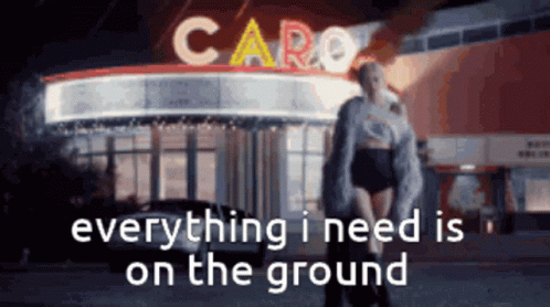 Woman Standing in Front of Caro Building