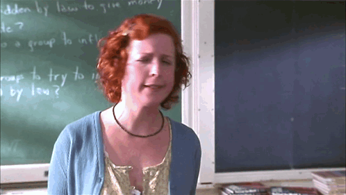 Woman Standing in Front of Chalkboard