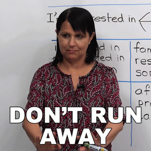 Woman Standing In Front Of Do Not Run Away Whiteboard GIF