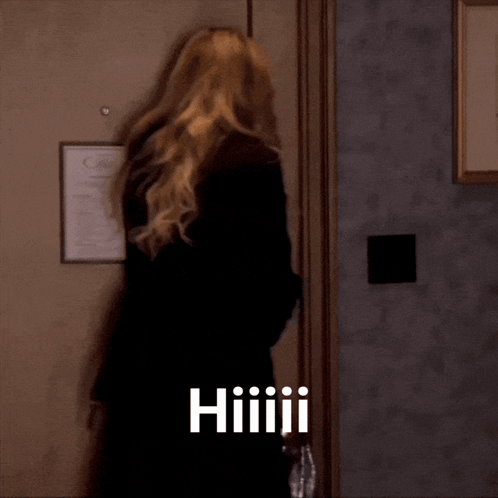 Woman Standing in Front of Door With Hiiiiii
