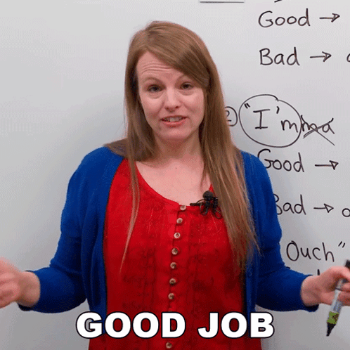 Woman Standing in Front of Good Job Whiteboard