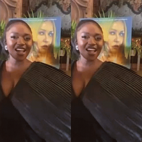 Woman Standing in Front of Her Poster