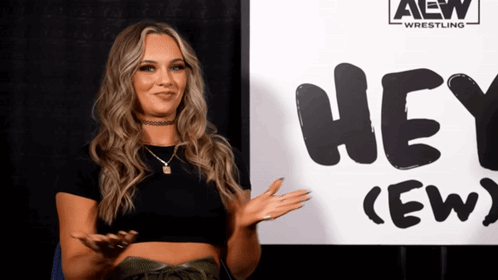 Woman Standing in Front of Hey (Ew) Sign