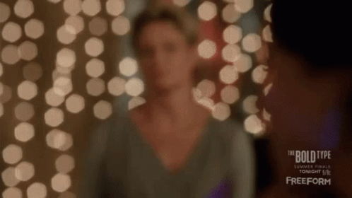 Woman Standing in Front of Lights