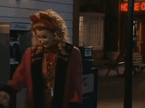 Woman Standing In Front Of Phone Booth GIF