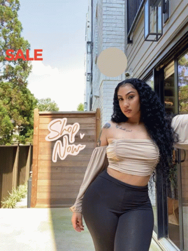 Woman Standing In Front Of Sale Sign GIF