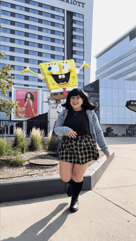 Woman Standing In Front Of SpongeBob Statue GIF