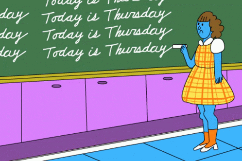 Woman Standing in Front of Thursday Blackboard