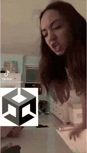 Woman Standing in Front of TikTok Icon