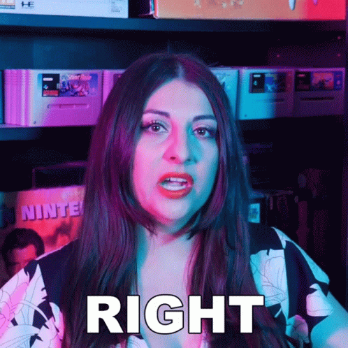 Woman Standing In Front Of Video Games Shelf GIF