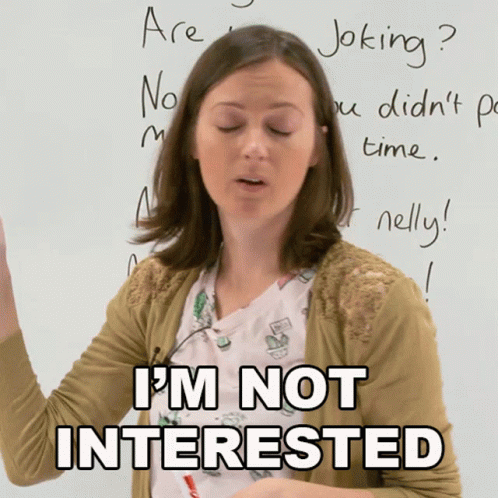 Woman Standing in Front of Whiteboard Saying I'm Not Interested