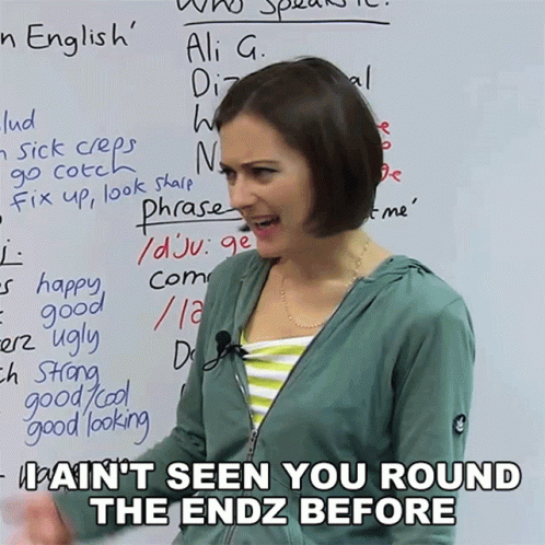 Woman Standing in Front of Whiteboard with Phrases