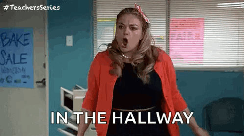 Woman Standing in Hallway with Open Mouth