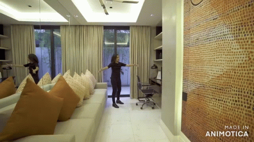Woman Standing In Living Room GIF