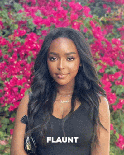 Woman Standing in Pink Flowers Flaunt