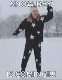 Woman Standing in Snow With Outstretched Arms