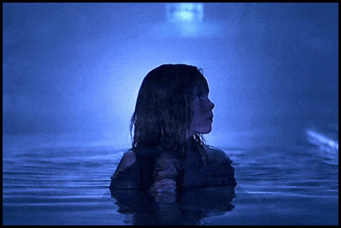 Woman Standing in Water With Ghost