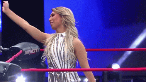 Woman Standing in Wrestling Ring Impact