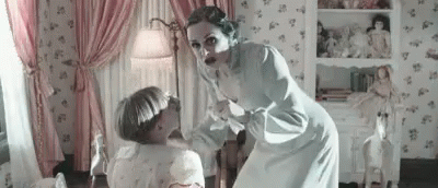 Woman Standing Next To Child In Pink Curtains GIF