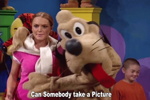 Woman Standing Next To Stuffed Animal Can Somebody Take A Picture GIF
