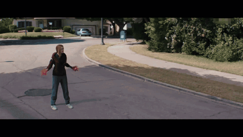 Woman Standing On Road With Arms Outstretched GIF