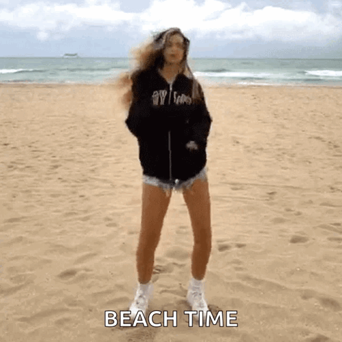 Woman Standing on Sandy Beach Saying Beach Time
