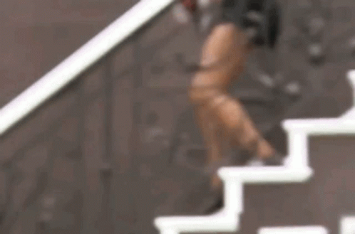 Woman Standing on Stairs