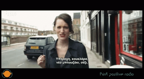 Woman Standing on Street With Think Positive Radio