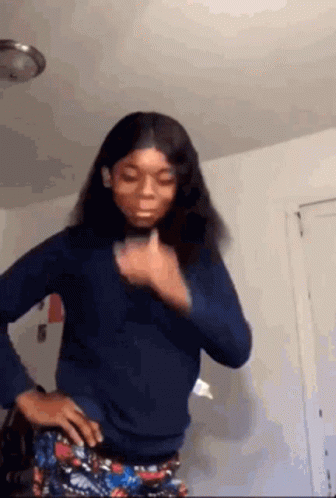 Woman Standing with Hands on Hips and Thumbs Up