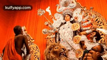 Woman Statue Holding Torch With Lion And Man GIF