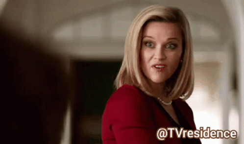 Woman Sticking Tongue Out In Kitchen GIF
