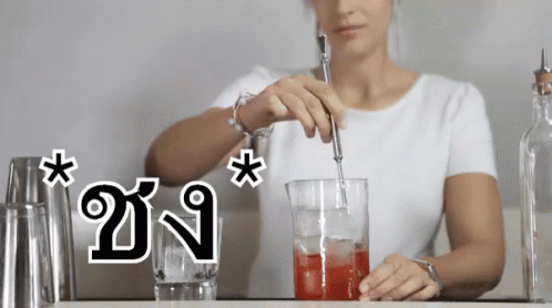 Woman Stirring Drink In Glass GIF