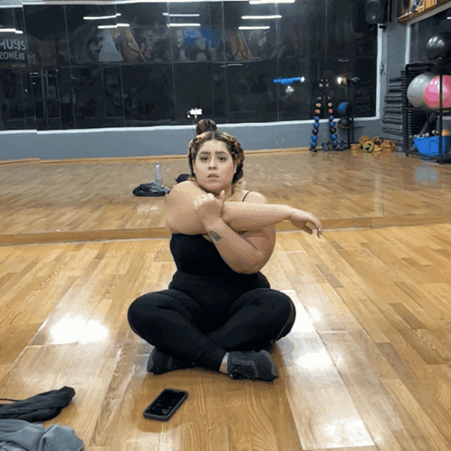 Woman Stretching On Gym Floor GIF