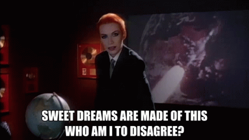 Woman Suit Tie Holding Wand Says Sweet Dreams Are Made Of This Who Am I To Disagree GIF