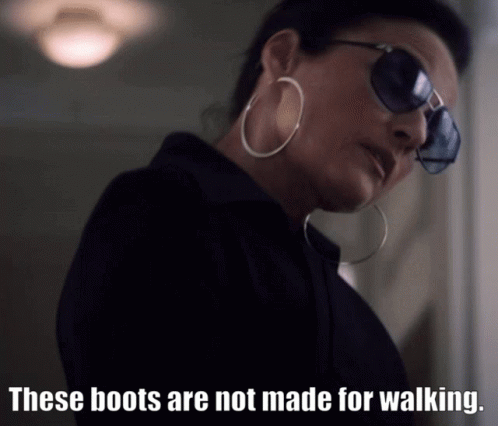 Woman Sunglasses Hoop Earrings These Boots Not Made For Walking GIF
