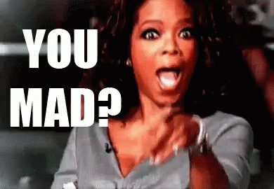Woman Surprised Pointing at Camera Says You Mad