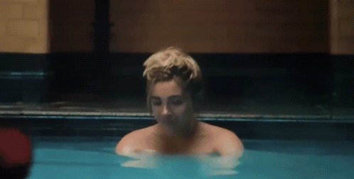 Woman Taking Bath In Blue Pool GIF