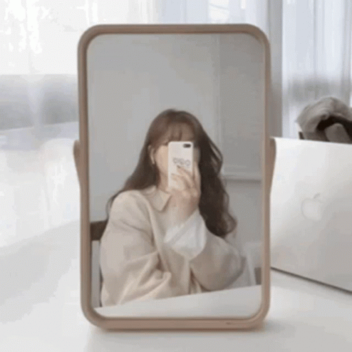 Woman Taking Selfie in Mirror