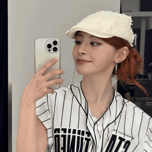 Woman Taking Selfie in Mirror Wearing Ota Jersey