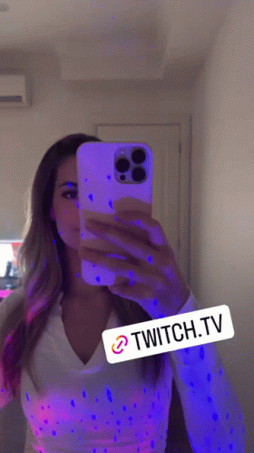 Woman Taking Selfie in Mirror With Glow in the Dark Paint