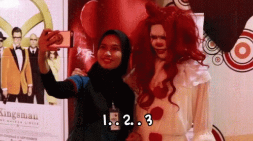 Woman Taking Selfie With Clown Saying Kingsman