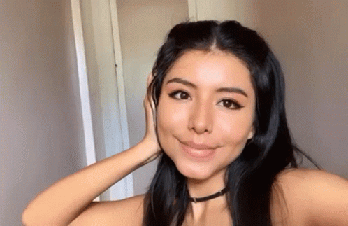 Woman Taking Selfie With Hand to Face