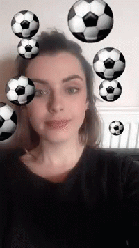 Woman Taking Selfie with Soccer Balls