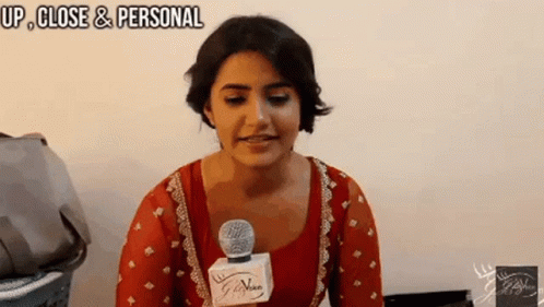 Woman Talking Into Microphone