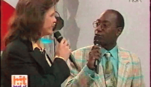 Woman Talking Into Microphone GIF