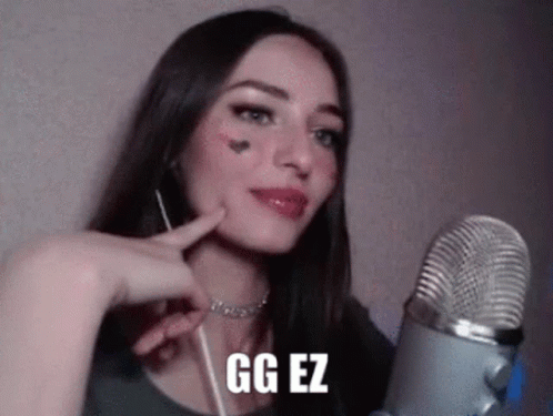 Woman Talking Into Microphone With GG EZ on Face