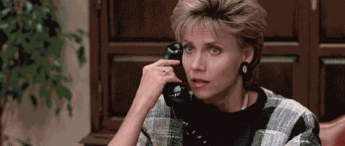 Woman Talking On Cell Phone GIF