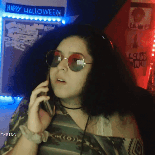 Woman Talking On Phone Halloween Sign GIF