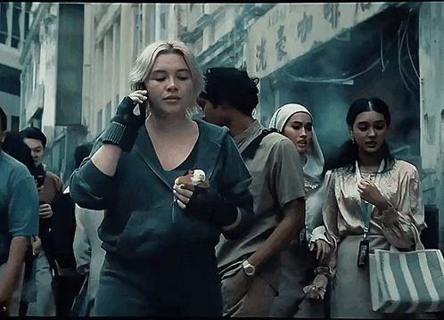 Woman Talking On Phone Holding Sandwich GIF