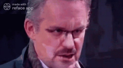 Woman Talking On Phone Looking In Mirror GIF